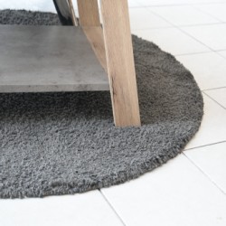 Grey low pile round carpet